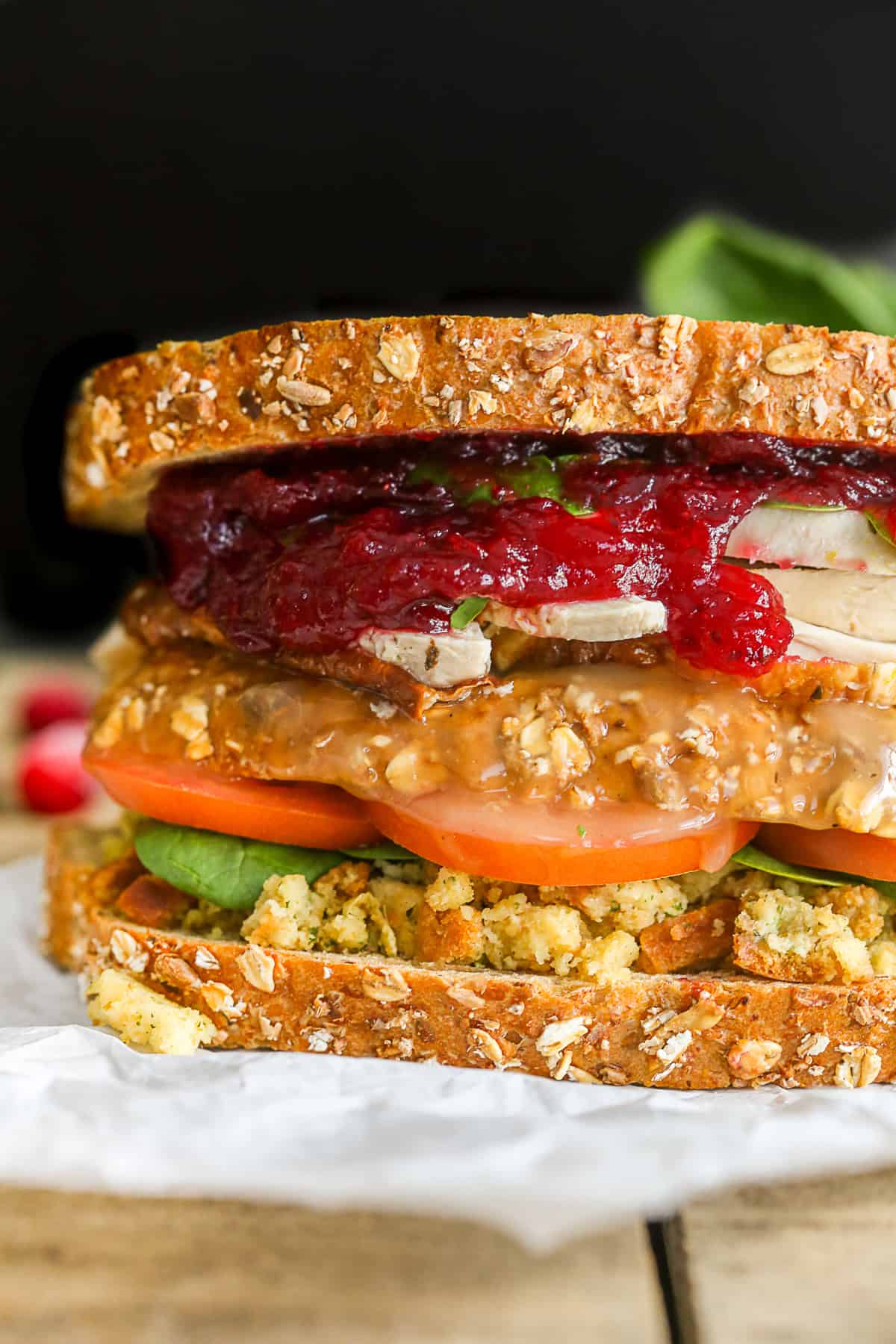 This leftover Thanksgiving sandwich with moist maker is the perfect way to pay homage to your favorite Friends episode. All the taste of a Thanksgiving dinner with a secrete gravy soaked moist maker middle! Leftover Thanksgiving Sandwich showing all it's layers.