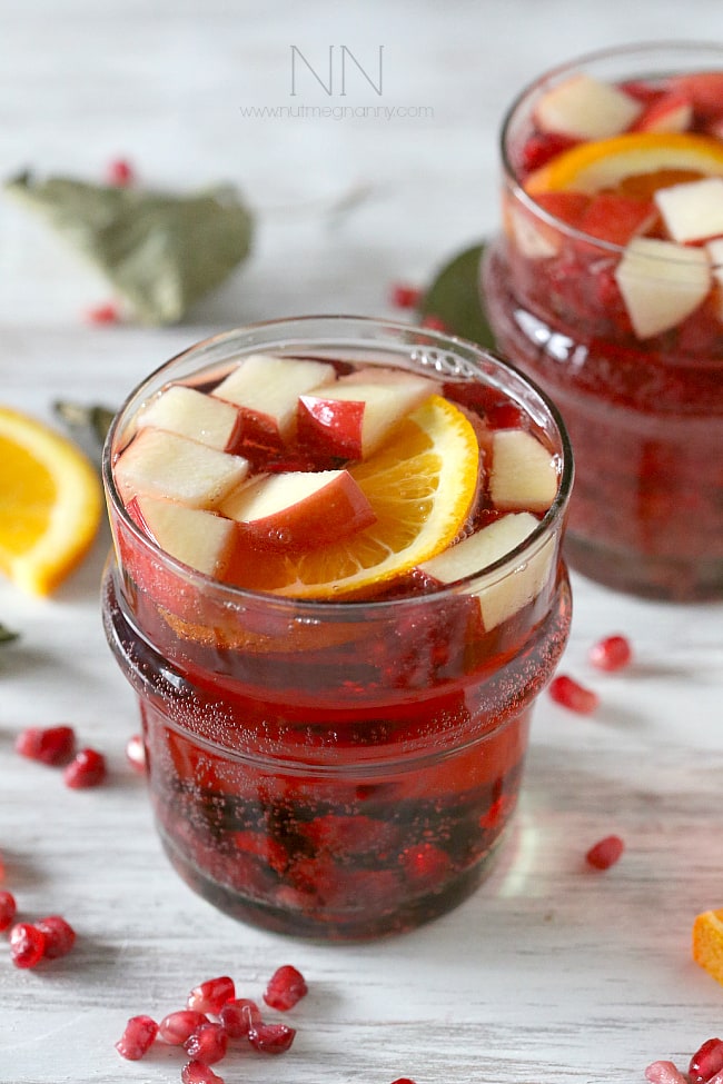 This simple Thanksgiving sangria is packed full of pomegranate seeds, apple, orange and semi sweet red wine. This drink is perfect for your holiday table.
