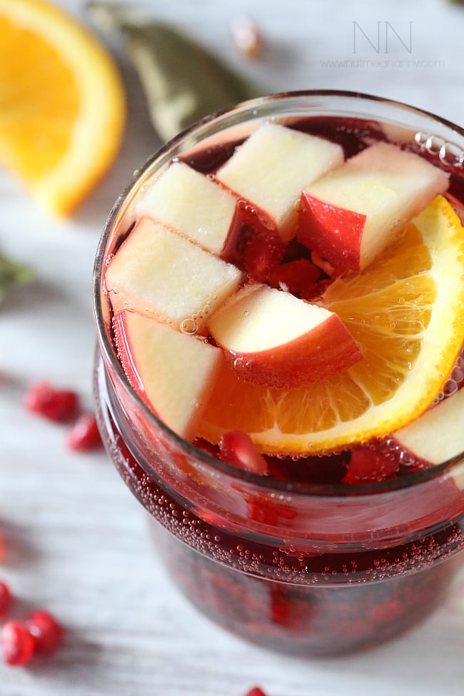 This simple Thanksgiving sangria is packed full of pomegranate seeds, apple, orange and semi sweet red wine. This drink is perfect for your holiday table.