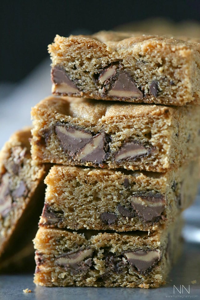 These peanut butter stuffed chocolate chip cookie bars are  bursting with lots of peanut butter deliciousness. Serve warm with a big glass of cold milk. 