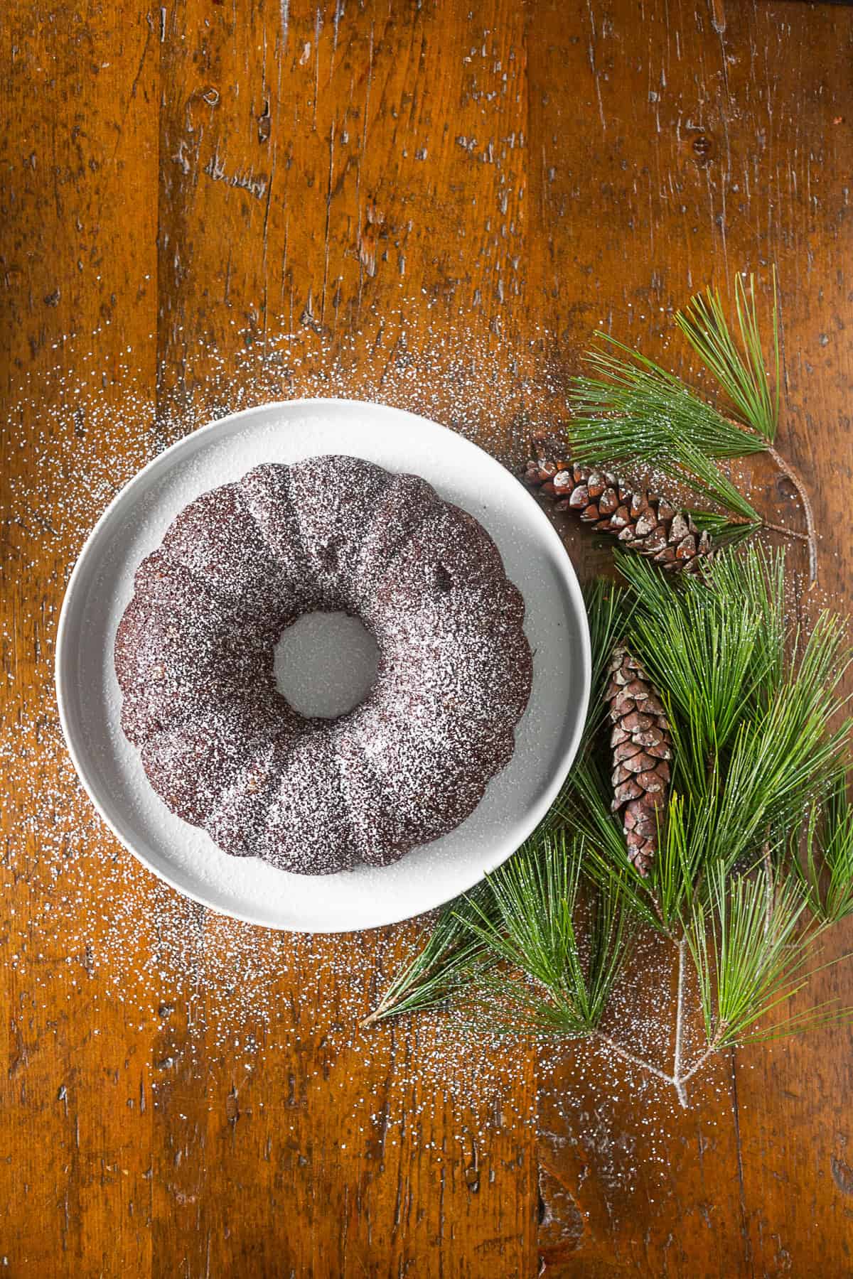 Chocolate Orange Gingerbread Cake on a white plate. 