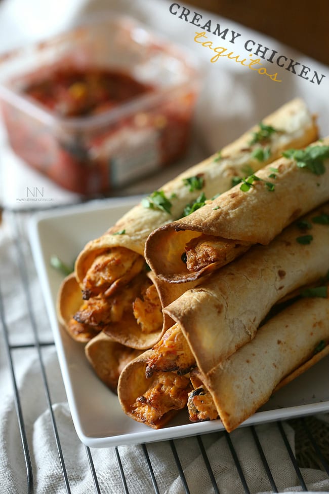 Creamy Chicken Taquitos served with cilantro. 