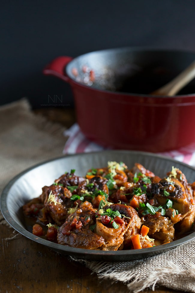 This homemade veal osso buco is the perfect holiday meal. Made with tomatoes, fresh herbs, a touch of white wine and a sprinkling of lemon zest. 