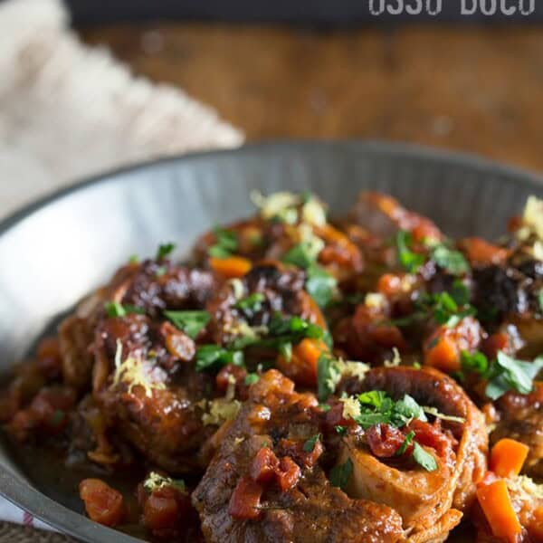 This homemade veal osso buco is the perfect holiday meal. Made with tomatoes, fresh herbs and a touch of white wine.