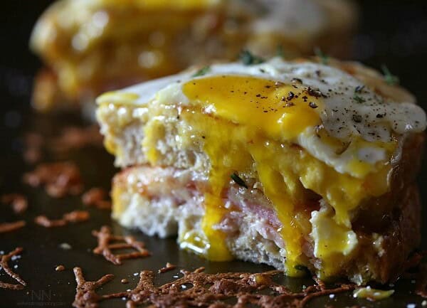 This croque madame is the perfect combination of bechamel cheese sauce, Canadian bacon and Swiss cheese stuffed between two slices of crusty bread. Perfect for breakfast or dinner.