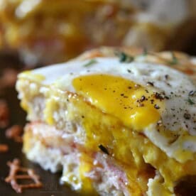 This croque madame is the perfect combination of bechamel cheese sauce, Canadian bacon and Swiss cheese stuffed between two slices of crusty bread. Perfect for breakfast or dinner.