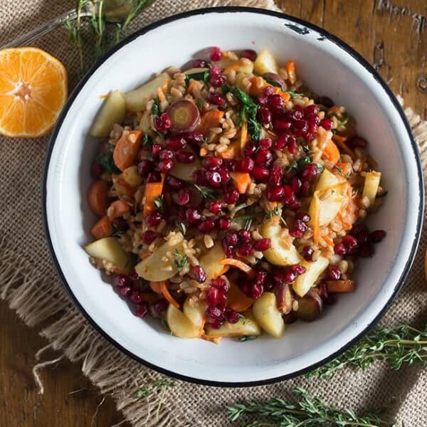 This farro carrot pomegranate salad is the perfect healthy side dish. It's packed full of vegetables and dressed with a simple squeeze of orange.