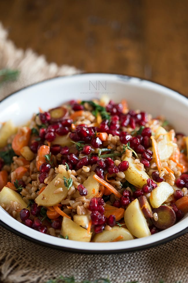 This farro carrot pomegranate salad is the perfect healthy side dish. It's packed full of vegetables and dressed with a simple squeeze of orange.