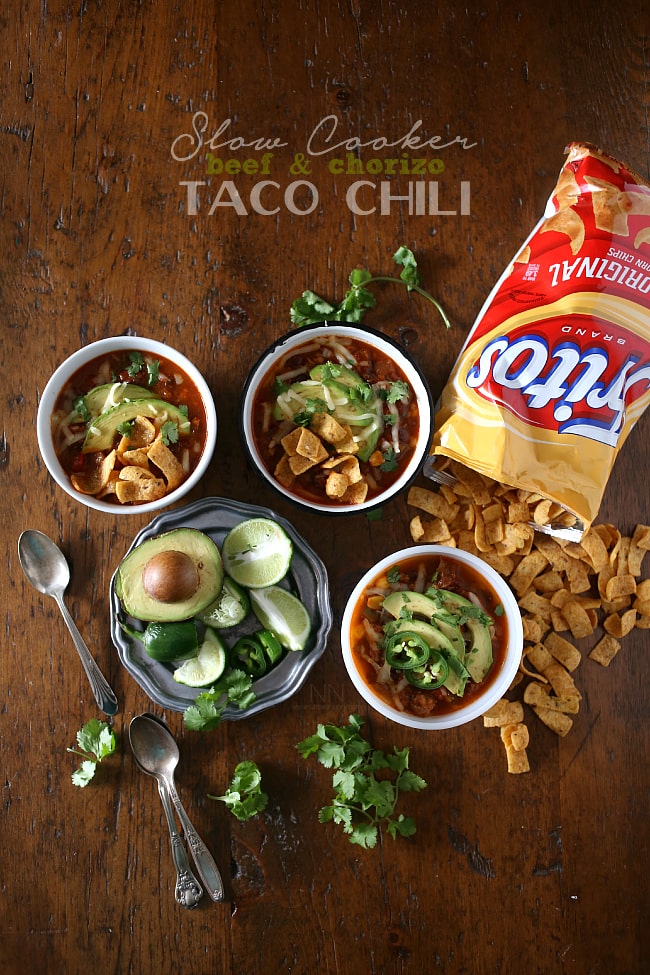 Slow Cooker Beef Chorizo Taco Chili toppings on a table. 