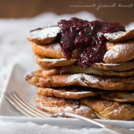 This sweet raspberry amaretto croissant French toast is the perfect Valentine's Day treat. Buttery croissants topped with a quick homemade raspberry sauce.