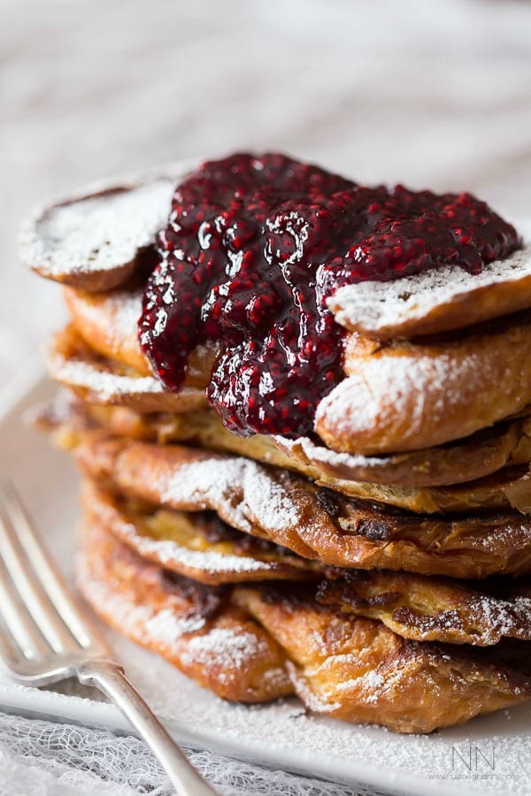 croissant french toast topped with raspberry amaretto topping. 