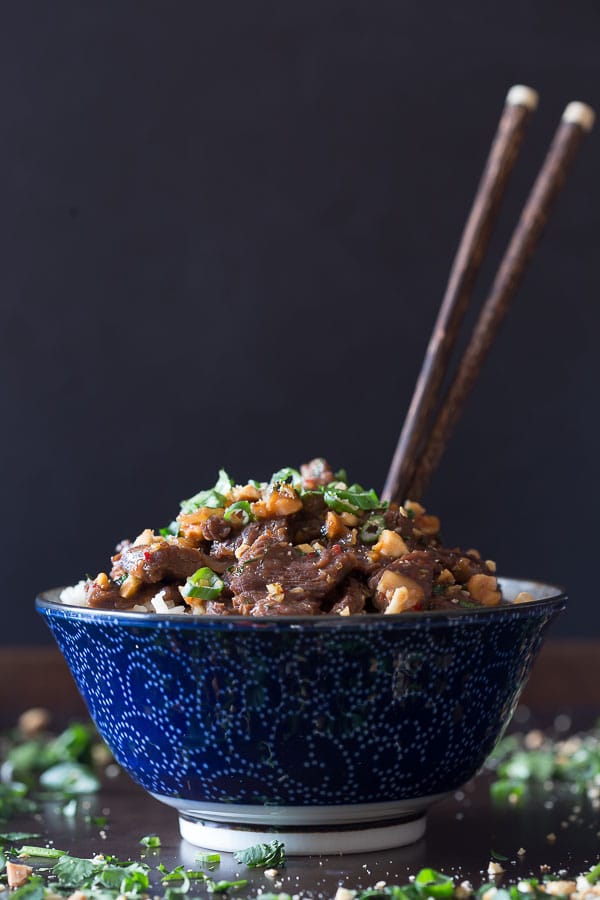 Spicy Beef with Peanuts in a bowl with chop sticks.