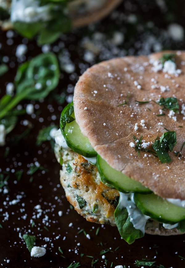 chicken souvlaki burgers stuffed in a pita pocket garnished with fresh cucumber