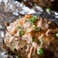 These twice baked stuffed reuben potatoes are perfect for St. Patrick's Day. These babies are stuffed with corned beef, sauerkraut, Swiss cheese and Russian dressing.