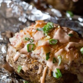 These twice baked stuffed reuben potatoes are perfect for St. Patrick's Day. These babies are stuffed with corned beef, sauerkraut, Swiss cheese and Russian dressing.