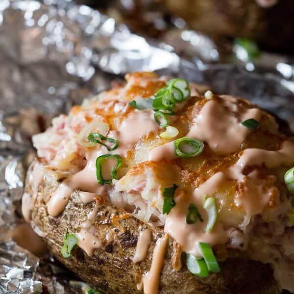 These twice baked stuffed reuben potatoes are perfect for St. Patrick's Day. These babies are stuffed with corned beef, sauerkraut, Swiss cheese and Russian dressing.