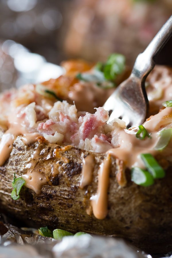 Twice Baked Stuffed Reuben Potatoes with a fork in it. 