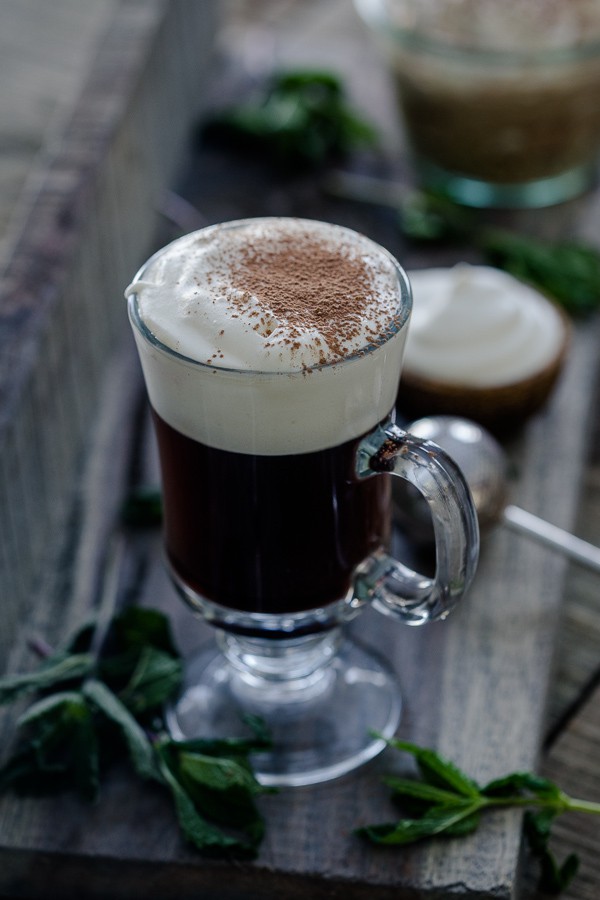 Traditional Irish Coffee topped with chocolate powder. 