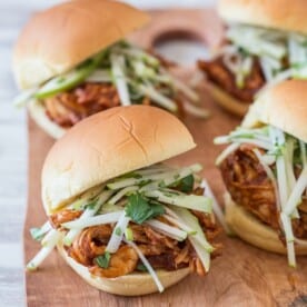 apple butter bbq chicken sandwich on a board