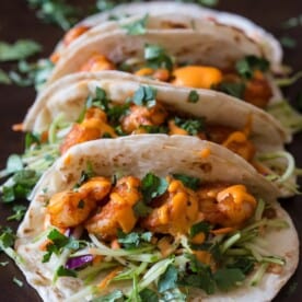These chipotle shrimp tacos are the perfect balance of sweet and spicy. Flour tortillas topped with tangy broccoli slaw, spicy shrimp and flavorful gochujang mayonnaise.