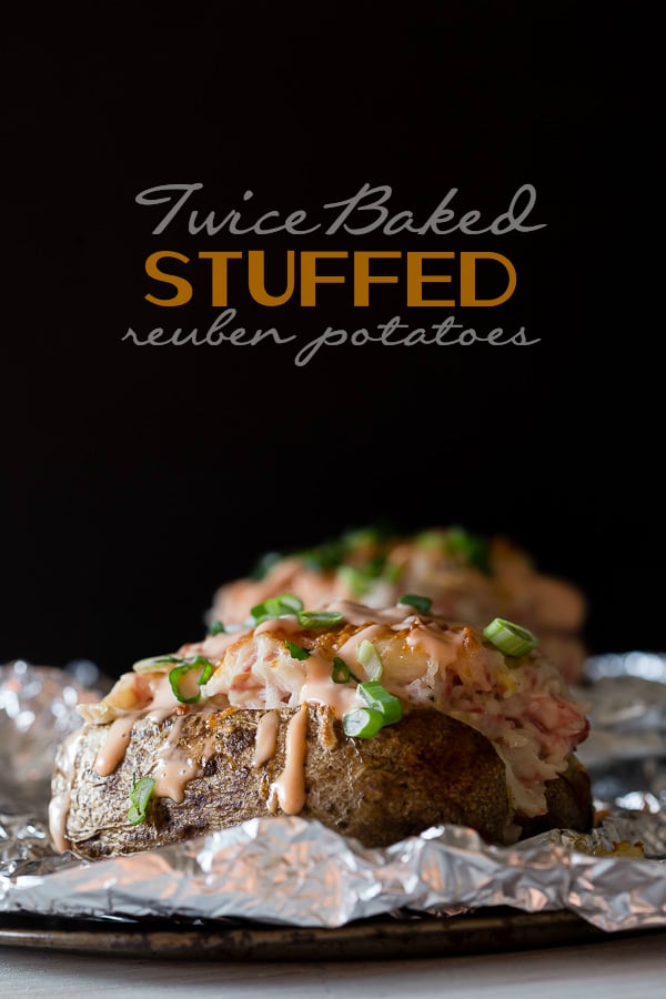Twice Baked Stuffed Reuben Potatoes on a baking sheet pan. 