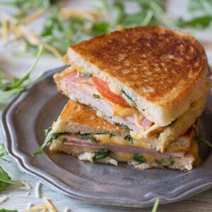 This totally cheesy Canadian BLT Grilled Cheese is stuffed with cheese, arugula, tomato and Canadian bacon. It's toasted till perfection and ready in no time!