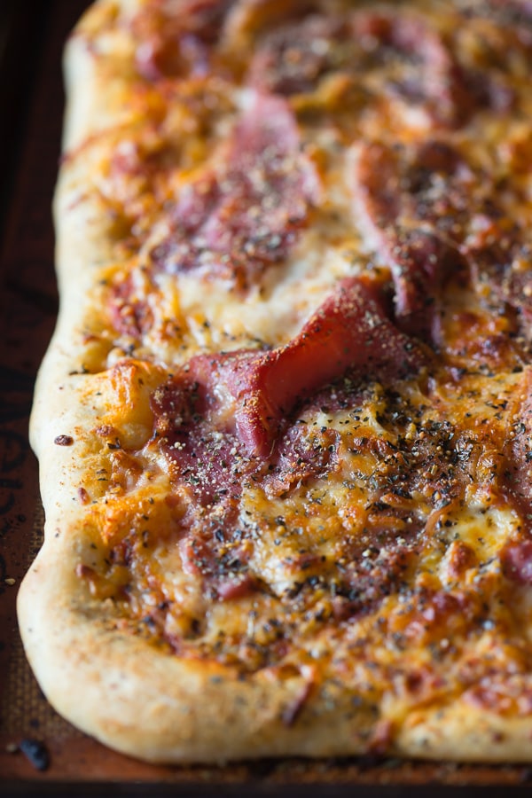 This delicious super cheesy parmesan prosciutto pizza is packed full of flavor and ready in just 30 minutes. Why order take out when you can easily make it at home?