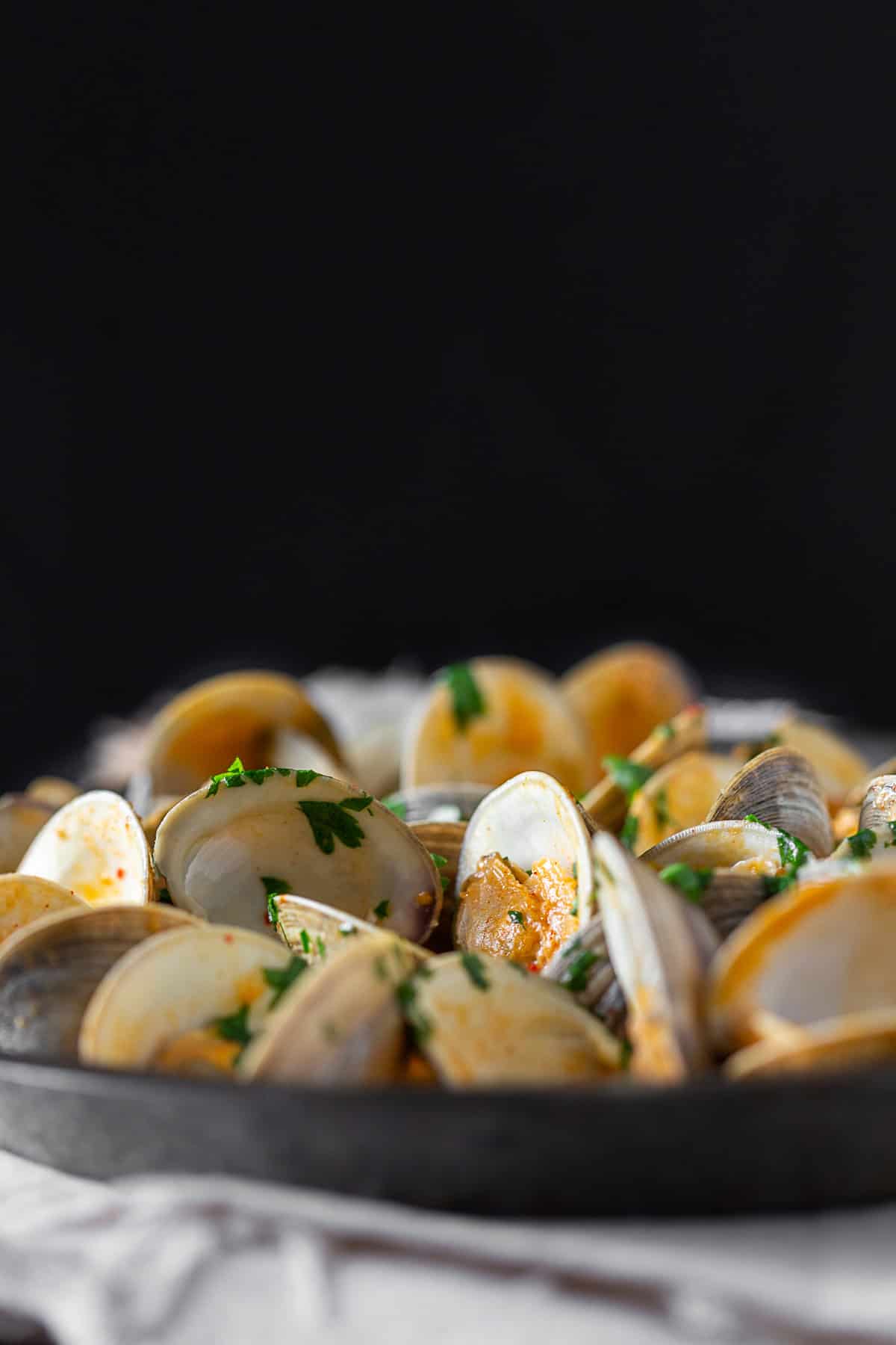 Spicy Coconut Milk Clams in a serving dish.