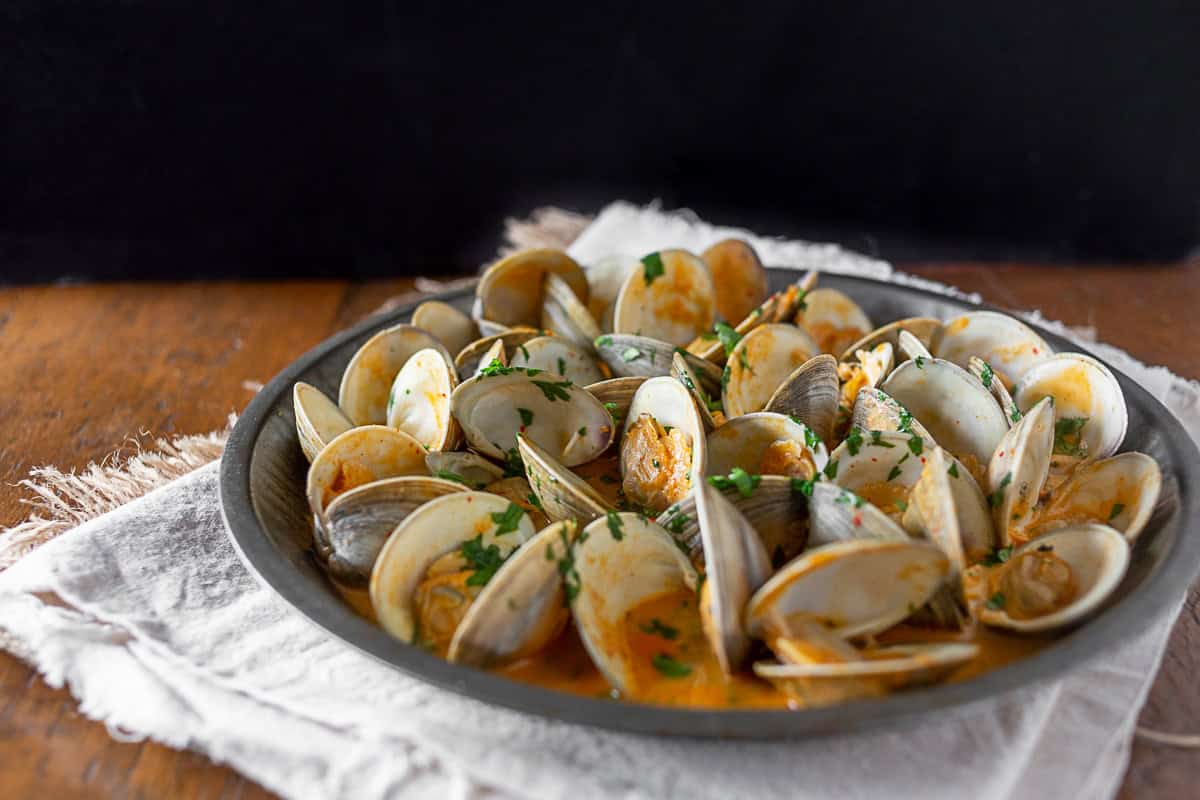 Spicy Coconut Milk Clams in a tray.