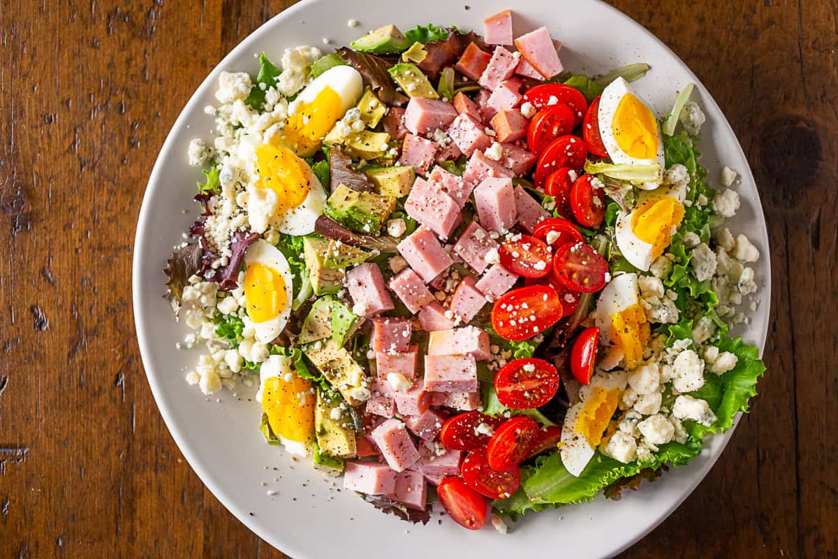 Ham Cobb Salad topped with blue cheese.