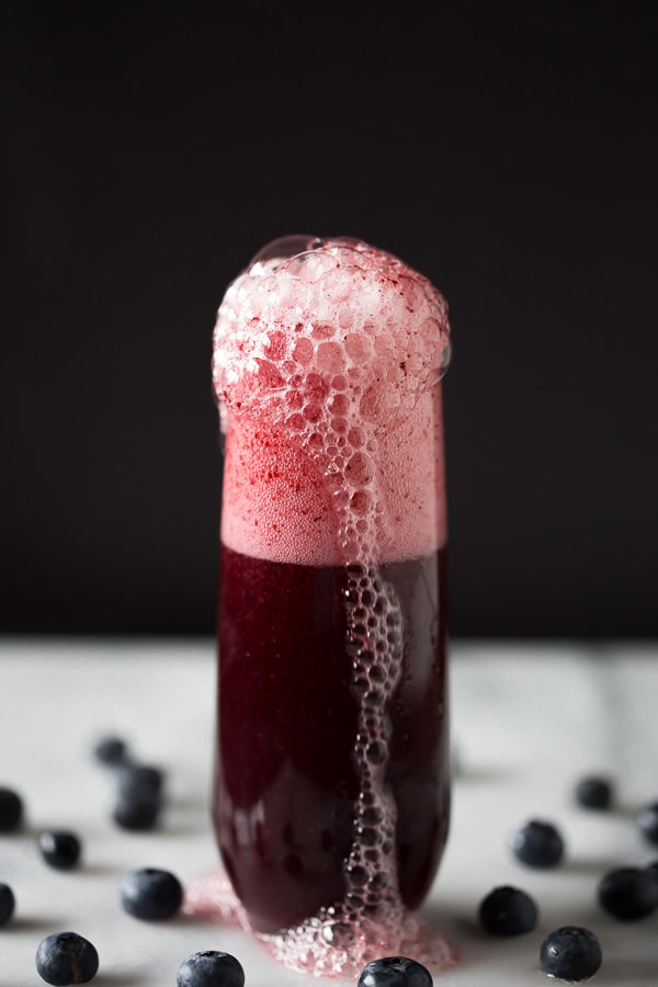 This mixed berry bellini is perfectly sweet and and packed full of blueberry and strawberry flavor. Served with a sugar rim and topped with sweet sparkling wine or prosecco.