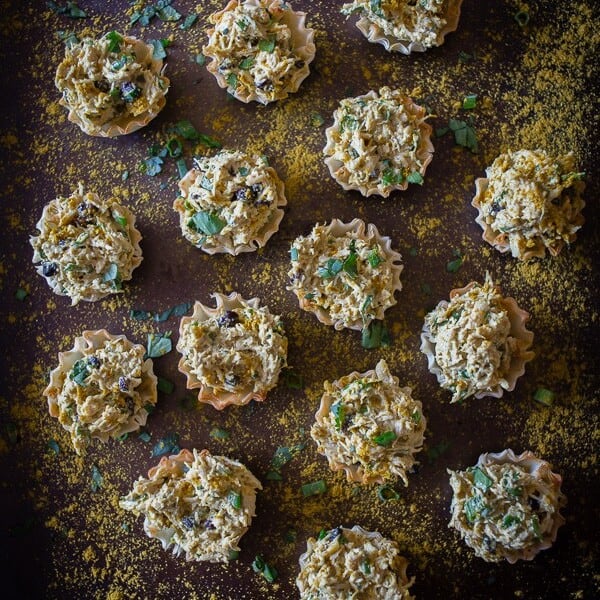 These little curried chicken salad phyllo cups are packed full of Greek yogurt, curry spice, cilantro and green onions. Then it's all packed into a crunchy phyllo cups for the perfect party appetizer. Plus they are ready in under 30 minutes!