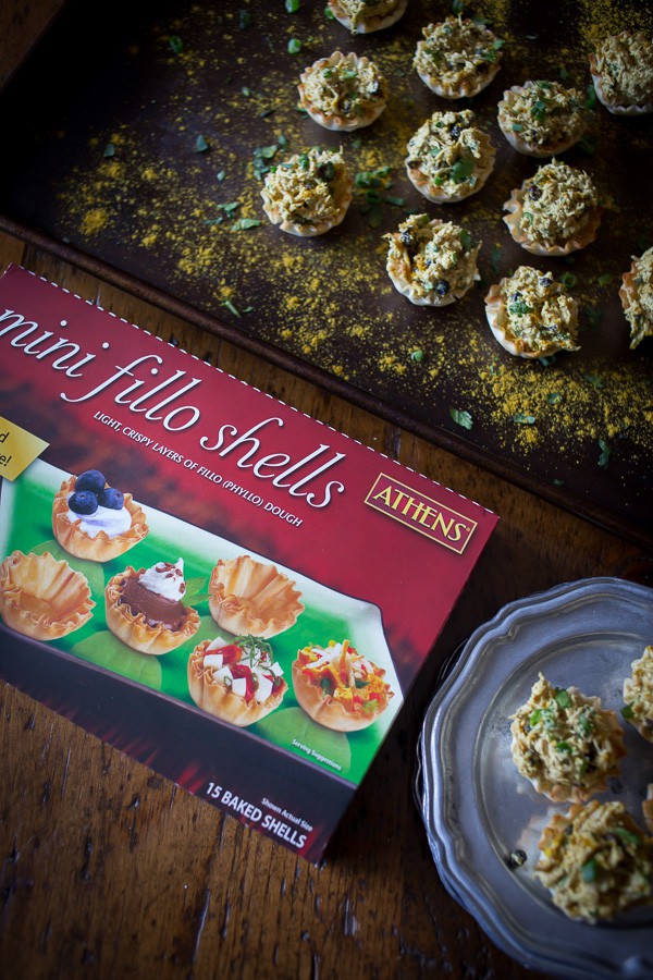 These little curried chicken salad phyllo cups are packed full of Greek yogurt, curry spice, cilantro and green onions. Then it's all packed into a crunchy phyllo cups for the perfect party appetizer. So simple and so easy!