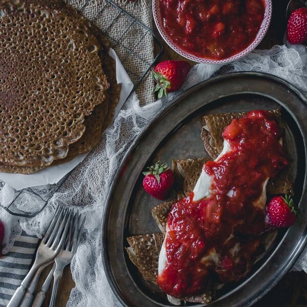 These buckwheat crepes with strawberry rhubarb compote and vanilla creme fraiche are the perfect way to celebrate spring. Plus they are naturally gluten free!