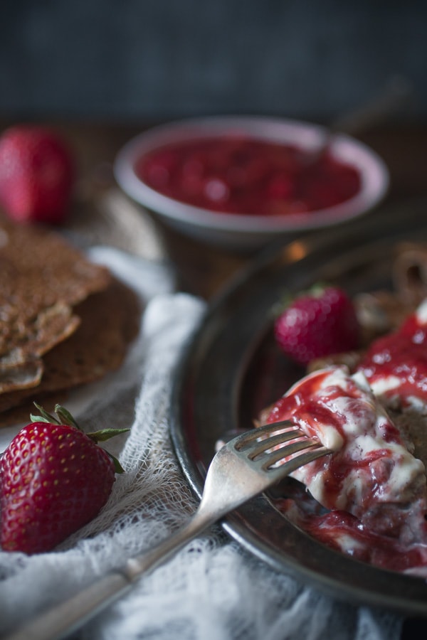 These buckwheat crepes with strawberry rhubarb compote and vanilla creme fraiche are the perfect way to celebrate spring. Plus they are naturally gluten free!