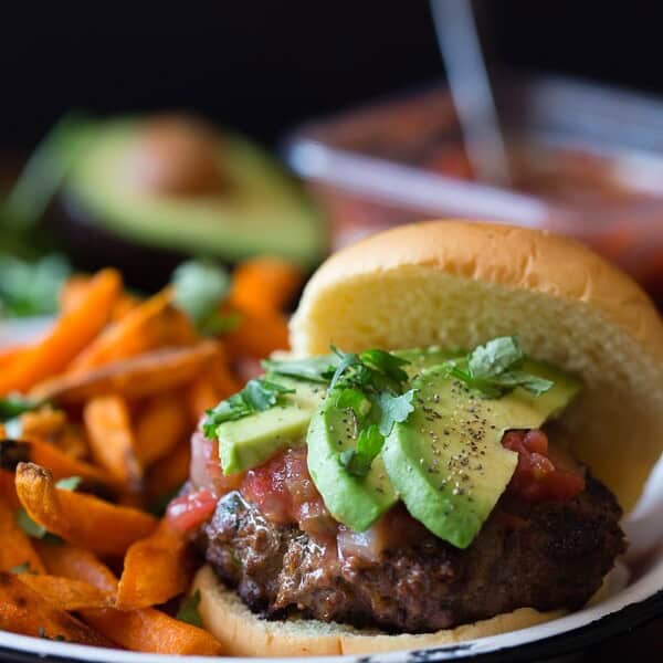 This cheesy salsa burger is perfect for your Cinco de Mayo celebration. This baby is packed full of flavor and lots of Sabra salsa. This is one packed burger!