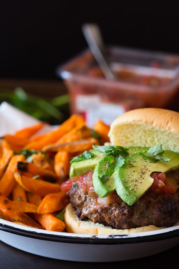 This cheesy salsa burger is perfect for your Cinco de Mayo celebration. This baby is packed full of flavor and lots of Sabra salsa. This is one packed burger!