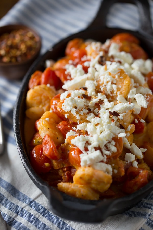 This skillet sherry shrimp and tomatoes is ready in under 30 minutes and packed full of spicy shrimp, feta cheese and cherry tomatoes. So easy and fresh! Great served over rice!
