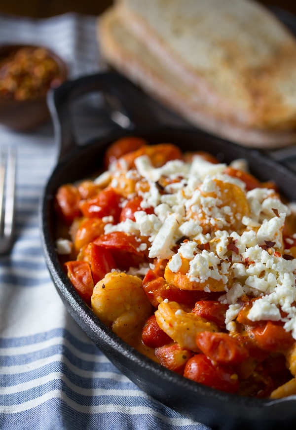 This skillet sherry shrimp and tomatoes is ready in under 30 minutes and packed full of spicy shrimp, feta cheese and cherry tomatoes. So easy and fresh! Great when served over couscous!