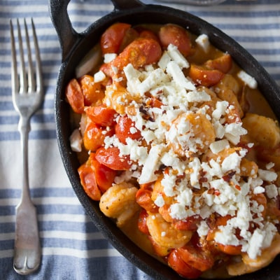 This skillet sherry shrimp and tomatoes is ready in under 30 minutes and packed full of spicy shrimp, feta cheese and cherry tomatoes. So easy and fresh! Great served over rice!