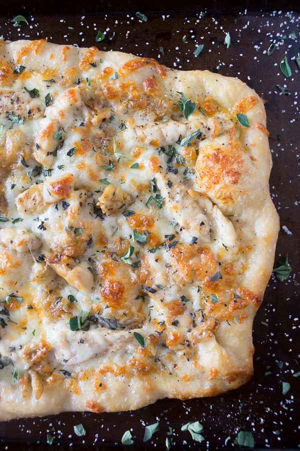 roasted garlic chicken pizza on a sheet pan