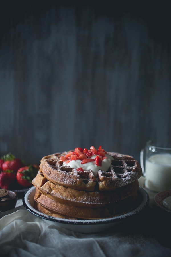 These strawberry yogurt waffles are the perfect way to start your day. These light and fluffy waffles are made with honey yogurt and fresh strawberries.