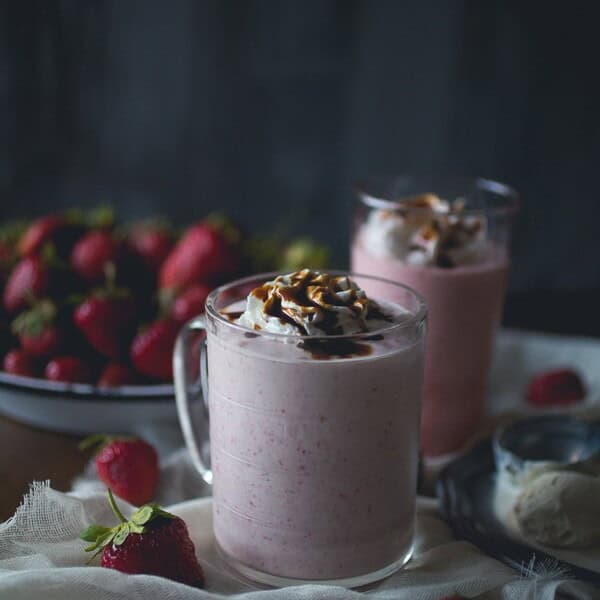 This strawberry creme fraiche milkshake with balsamic vinegar drizzle is the perfect summer treat. Perfectly chilled and great for summer porch sipping.