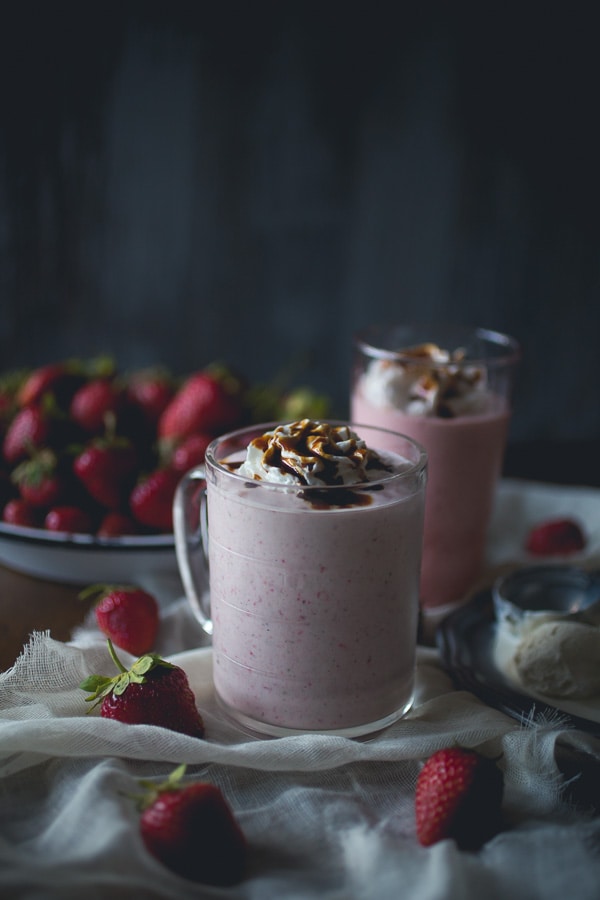 This strawberry creme fraiche milkshake with balsamic vinegar drizzle is the perfect summer treat. Perfectly chilled and great for summer porch sipping.