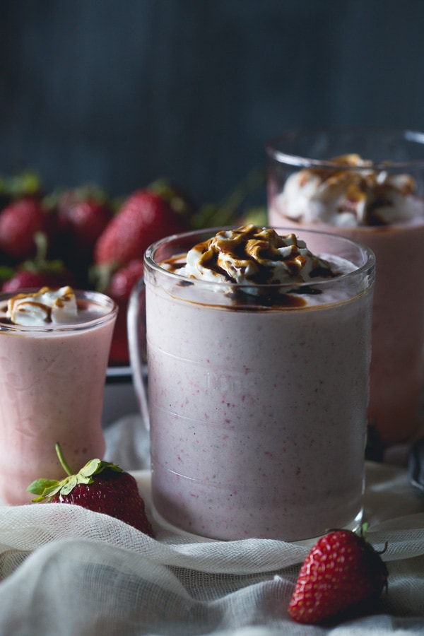 This strawberry creme fraiche milkshake with balsamic vinegar drizzle is the perfect summer treat. Perfectly chilled and great for summer porch sipping.