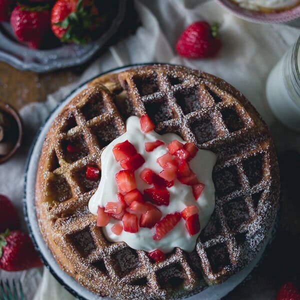 These strawberry yogurt waffles are the perfect way to start your day. These light and fluffy waffles are made with honey yogurt and fresh strawberries.