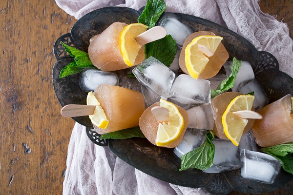 These sweet tea popsicles are the perfect way to enjoy summer. I froze up Southern sweet tea flavored with lemon and mint to create the perfect hot summer day treat.