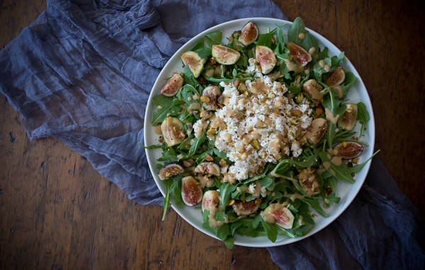 This fig goat cheese salad with fig vinaigrette is the perfect late summer salad. Packed full of fresh figs, goat cheese, pistachios and a homemade fig vinaigrette.