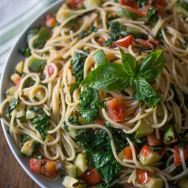 This zucchini tomato kale pasta packs all the flavors of summer into one pasta dish. Simple to throw together and ready in under 30 minutes!