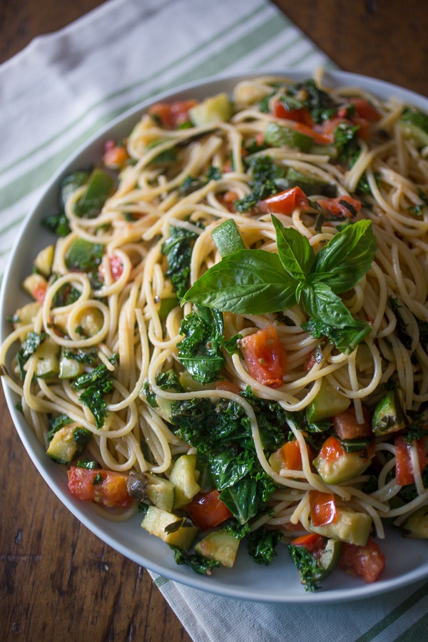 This zucchini tomato kale pasta packs all the flavors of summer into one pasta dish. Simple to throw together and ready in under 30 minutes!